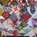 display of handmade pot holders at handmade quilts & crafts